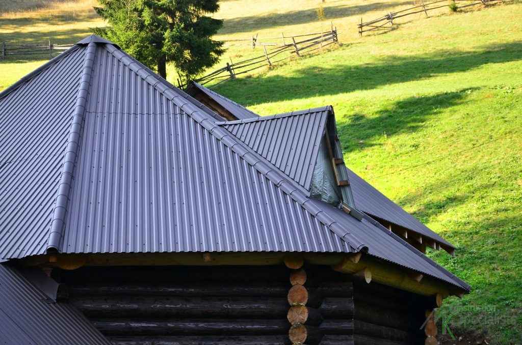 metal roof with grass in the background