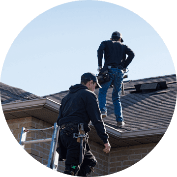 Roofers assessing roof damage