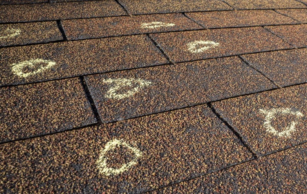roof with chalk marks that indicate hail damage