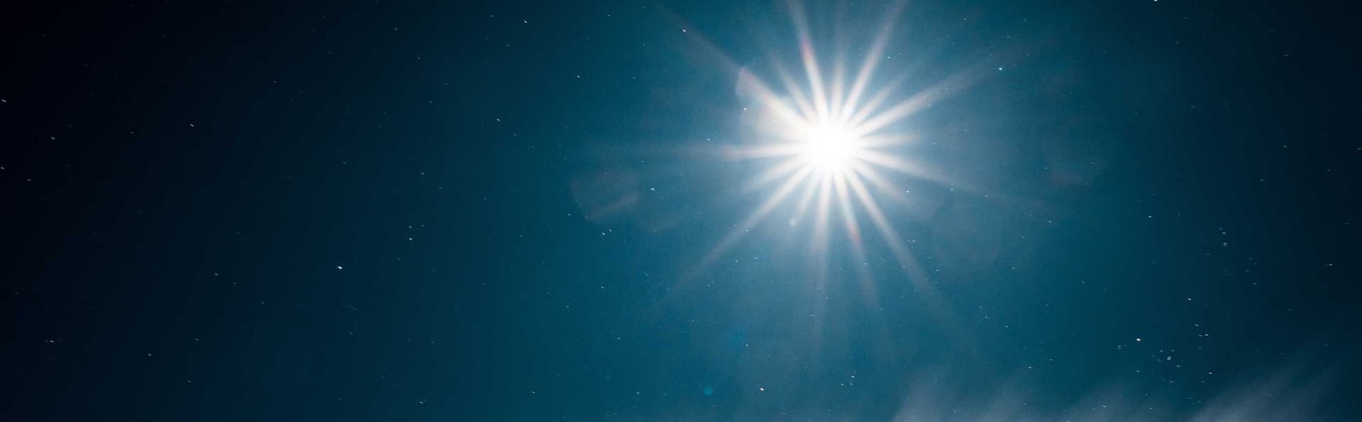Scenic View Of Bright Sun Shining In Pure Dark Blue