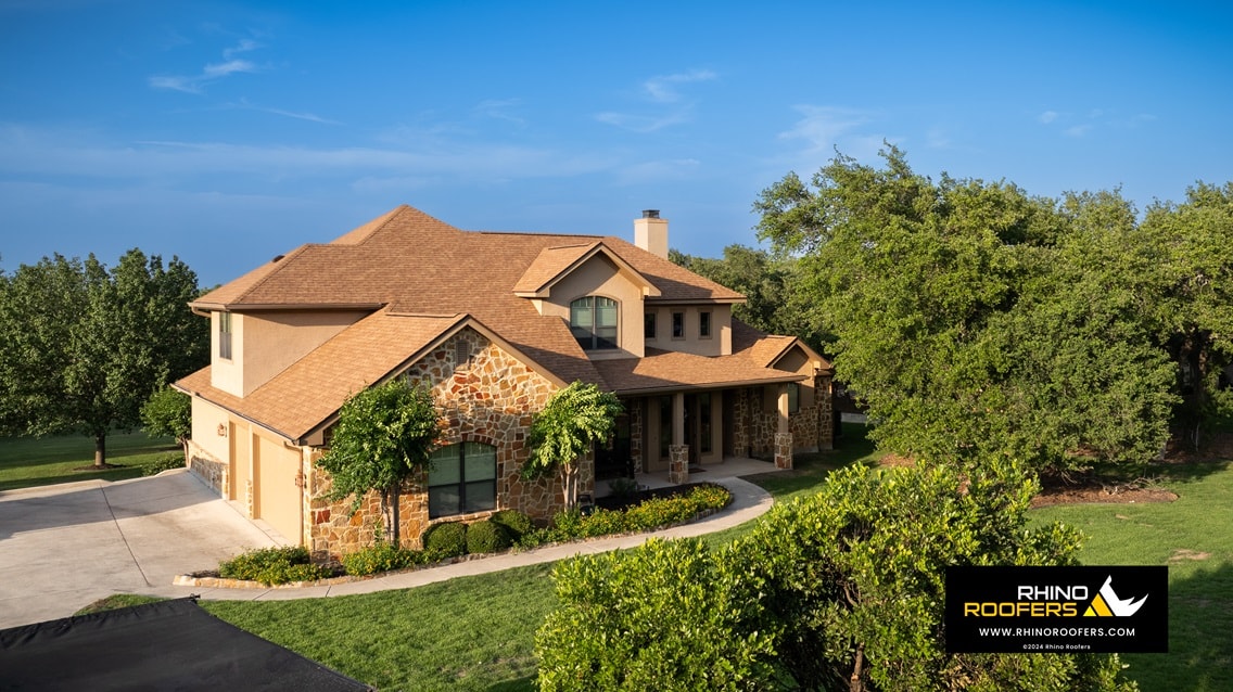 Completed Rhino Roofers roof replacement on a Spring Branch home, aerial view