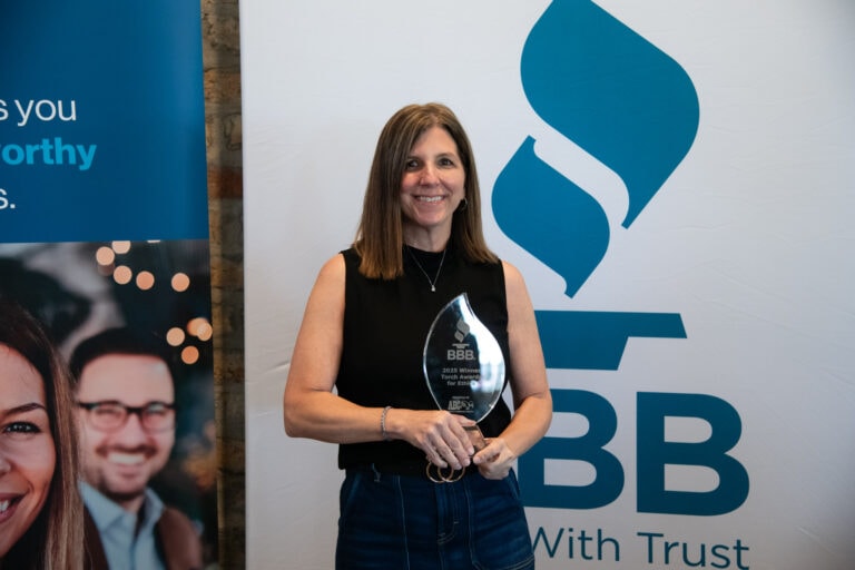 Rhino Roofers team accepting the BBB Torch Award for Ethics in Central Texas for outstanding integrity and customer trust.