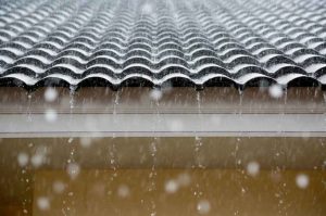tile roof with rain falling off