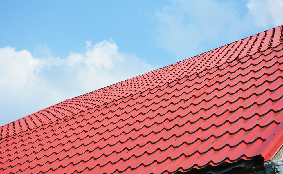 red tile roof with sky in the background