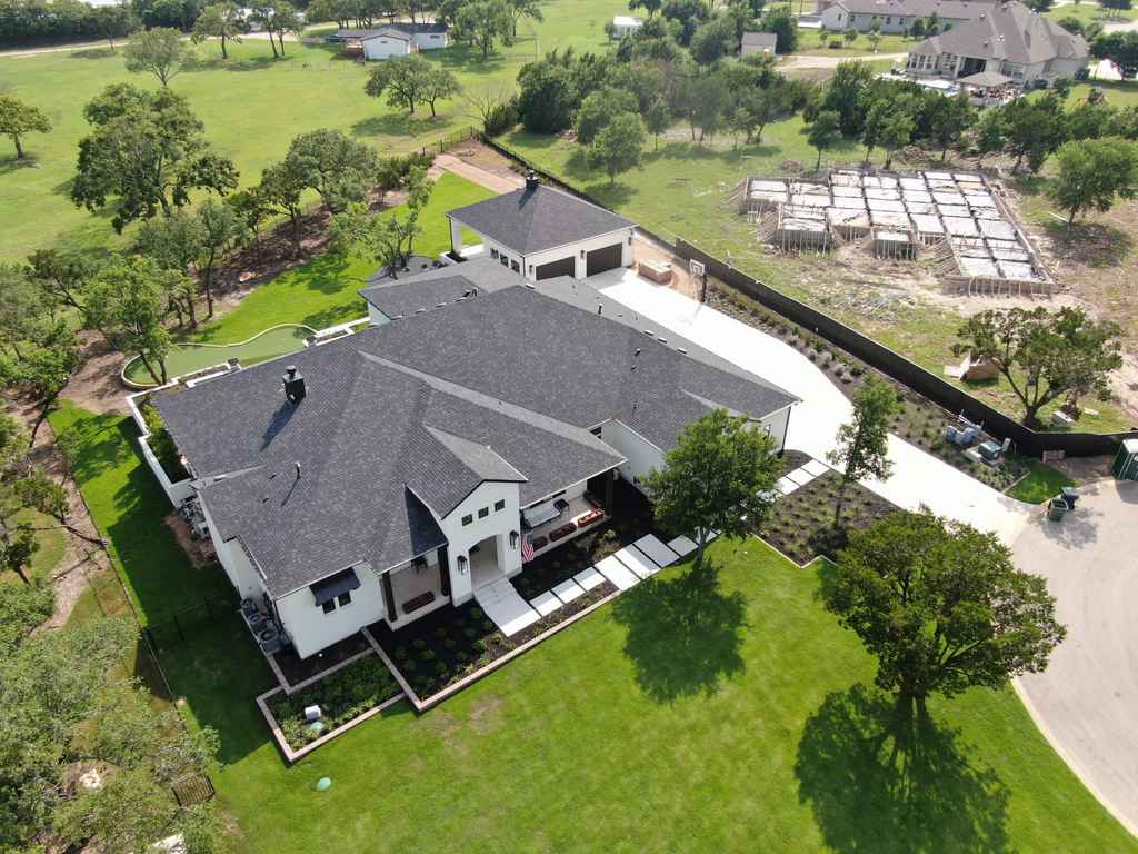 Asphalt shingle roof installed by Rhino Roofers on a San Antonio home, aerial view