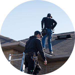 Roofers assessing roof damage