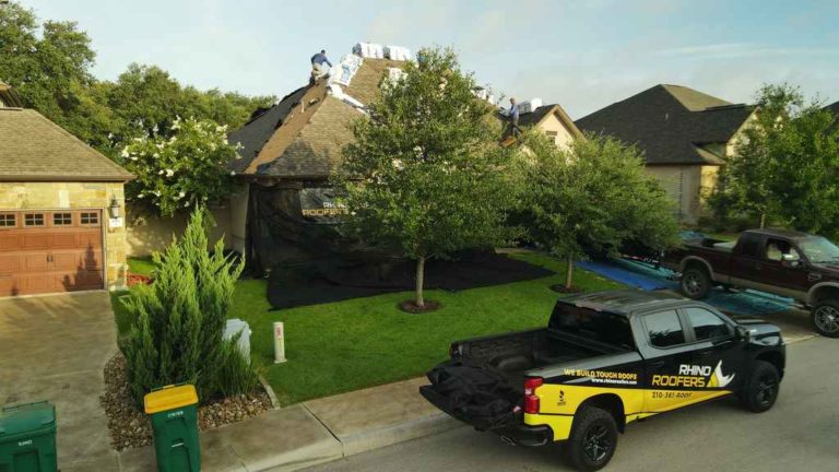 rhino roofer truck in a residential neighborhood
