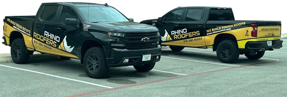 rhino roofers trucks in the parking lot