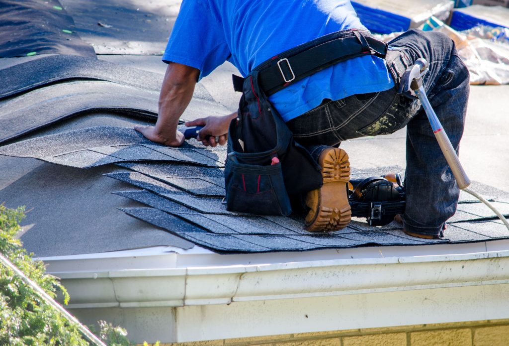 roof technician on building