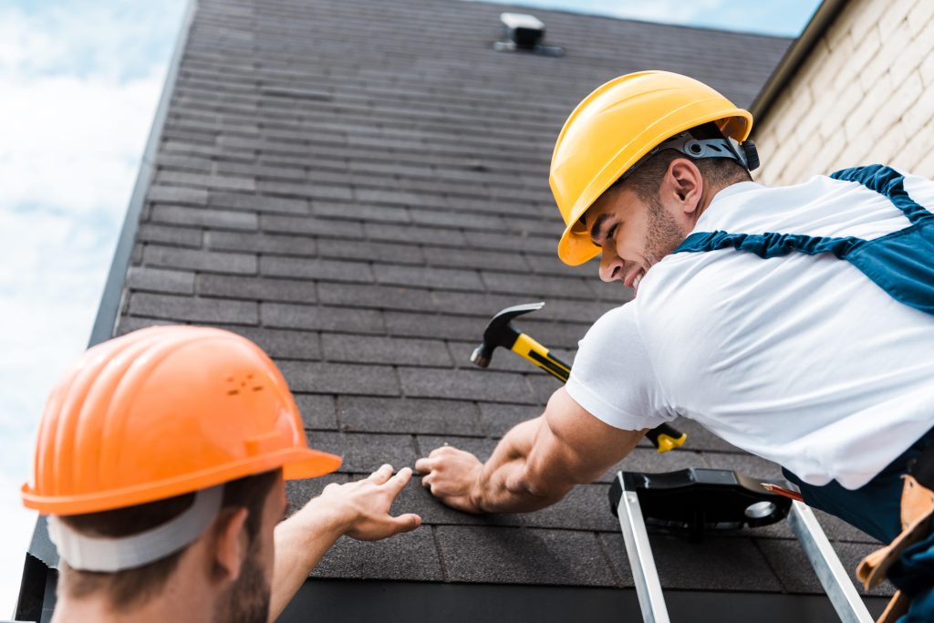 roof techs making repairs