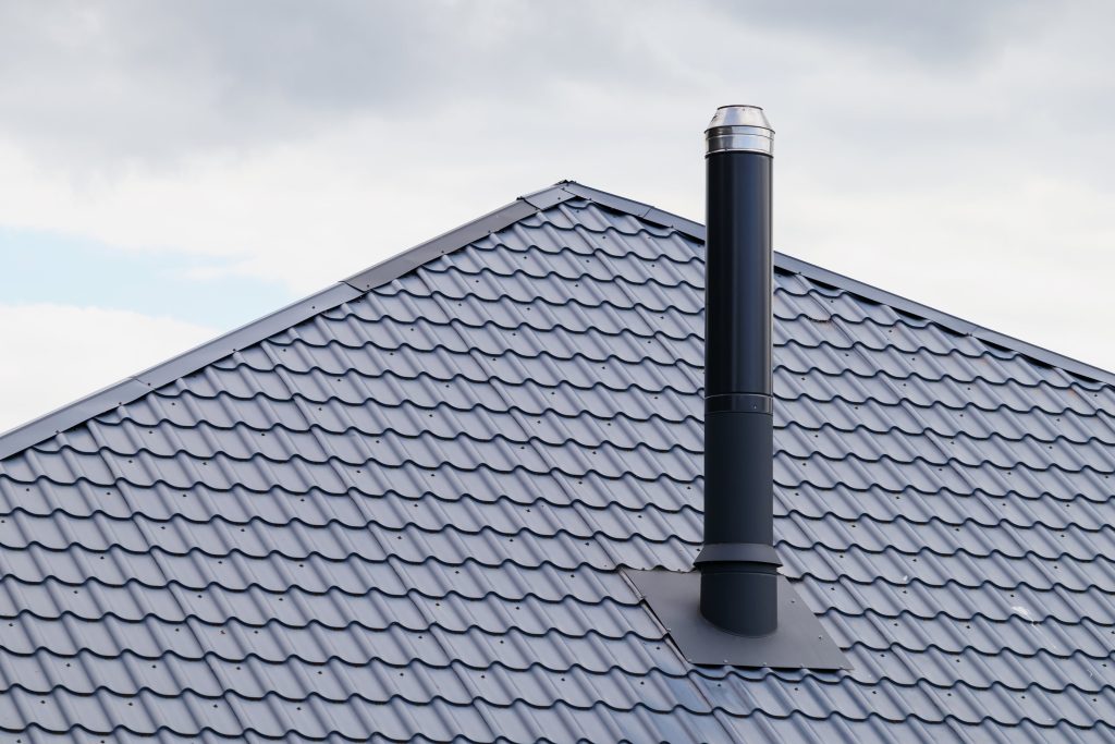 sloped metal roof with chimney
