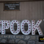 Large “SPOOKY” marquee sign at Josabi’s Acres in Helotes welcoming families to the Kinetic Kids Halloween community event.