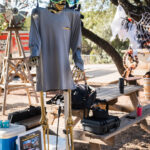 Skeleton wearing a Rhino Roofers shirt and sunglasses decorating the company booth at the Kinetic Kids Family Unite Night.