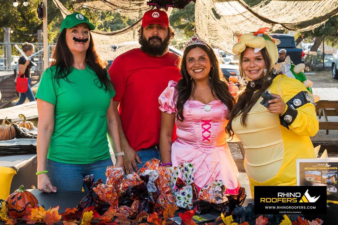 Rhino Roofers team dressed as Mario, Luigi, Princess Peach, and Bowser at the Kinetic Kids Family Unite Night in Helotes.