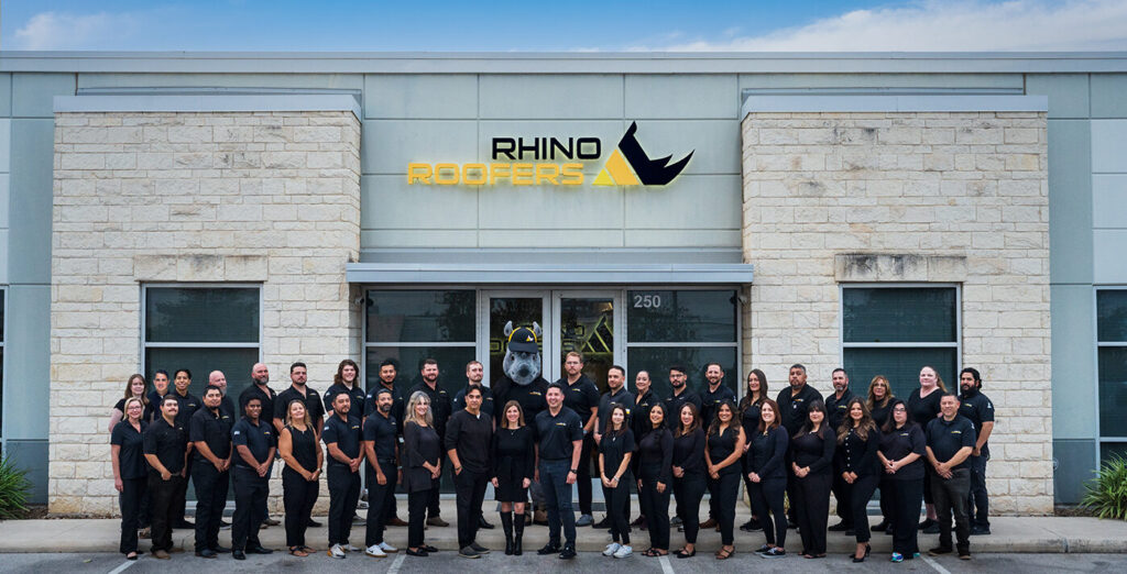 Group photo of the Rhino Roofers team honored with the BBB Torch Award for Ethics